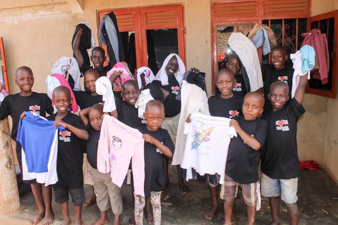 Children in worn, torn clothing showing the need for clothing assistance